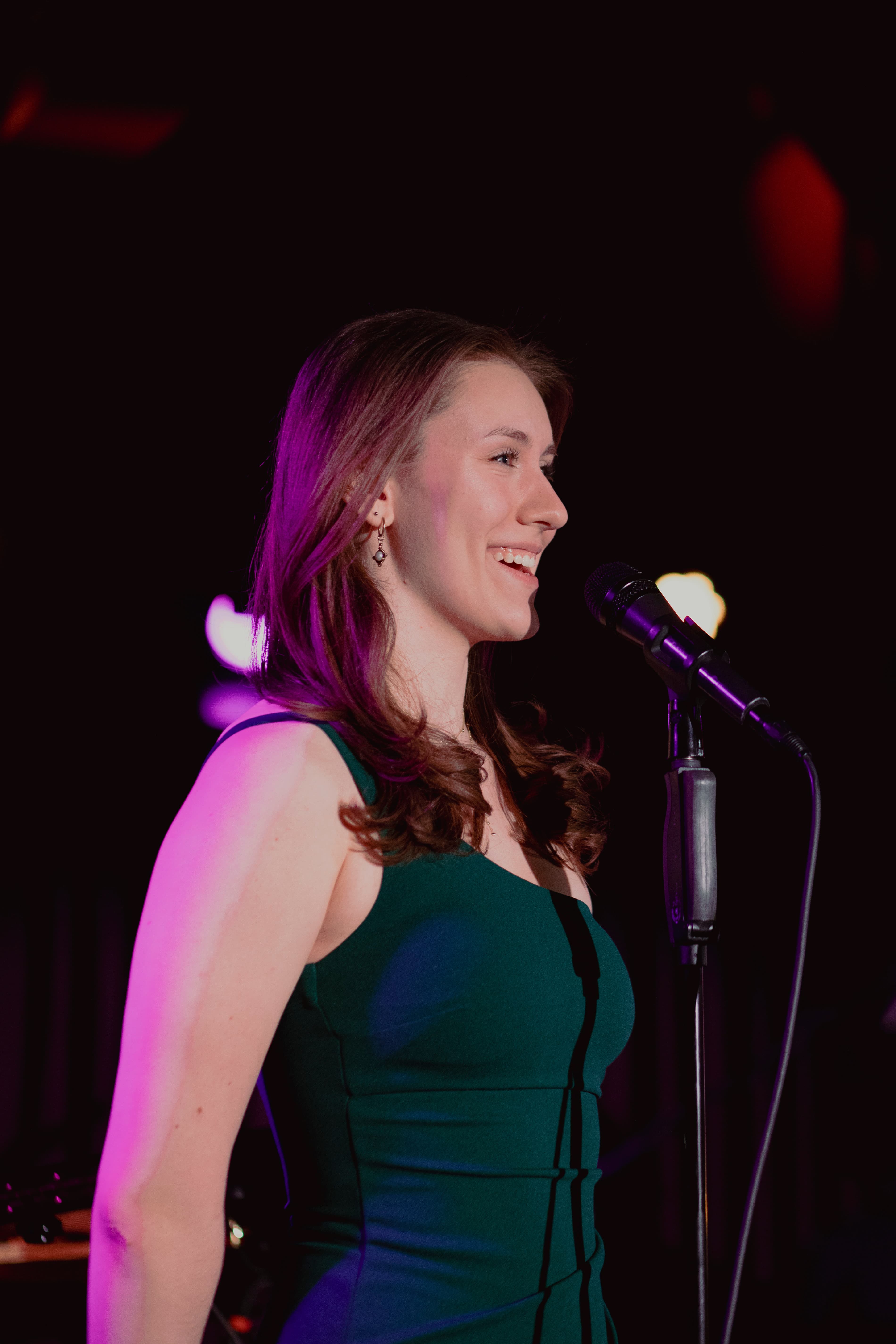 Maya Cassell singing under stage lights